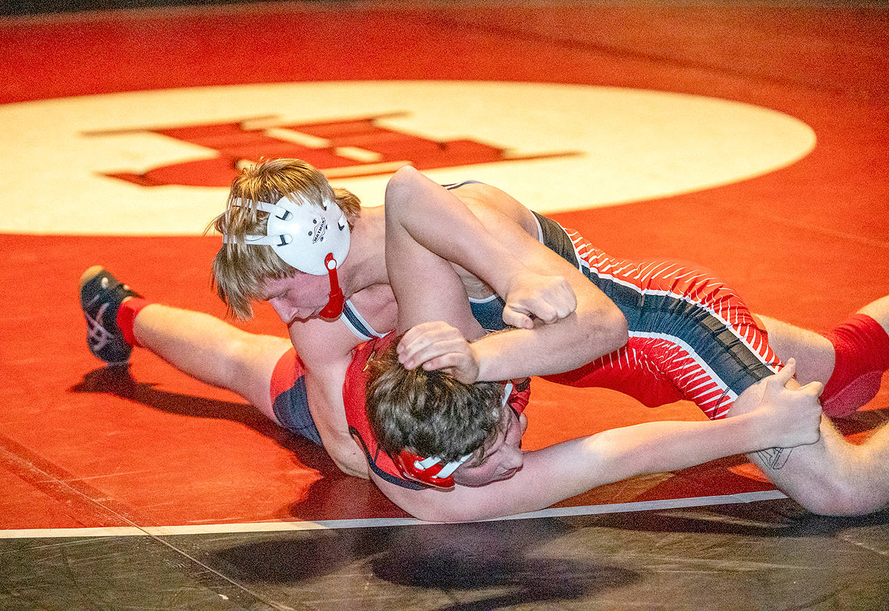 Port Townsend’s Ian Linn-Glasgow pins Seattle Academy’s Jack Cunard during a competition at Port Townsend High School on Wednesday. (Steve Mullensky/for Peninsula Daily News)