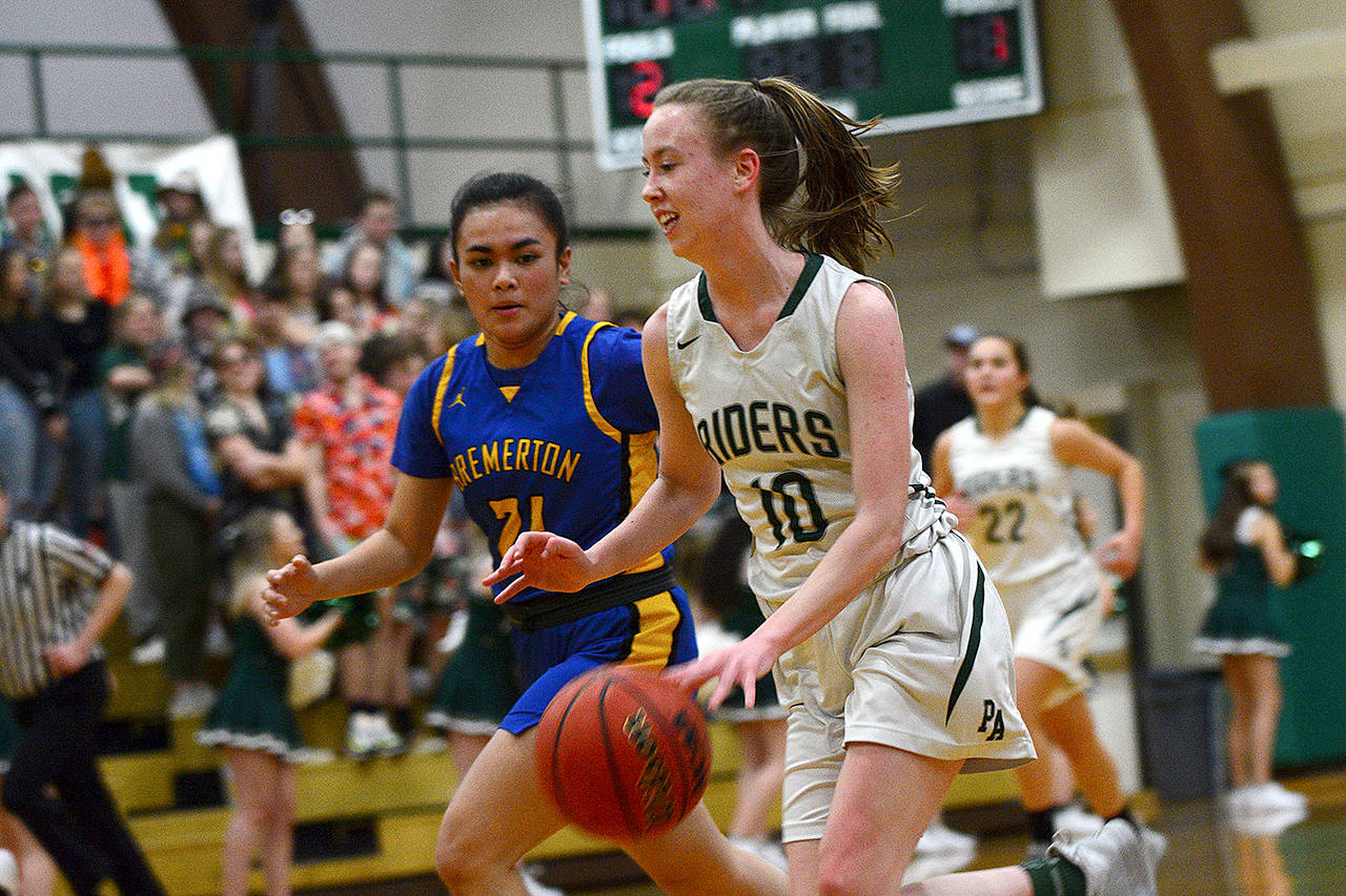 Jesse Major/for Peninsula Daily News Port Angeles’ Mikkiah Brady runs up court in the Roughriders’ game against Bremerton Friday.