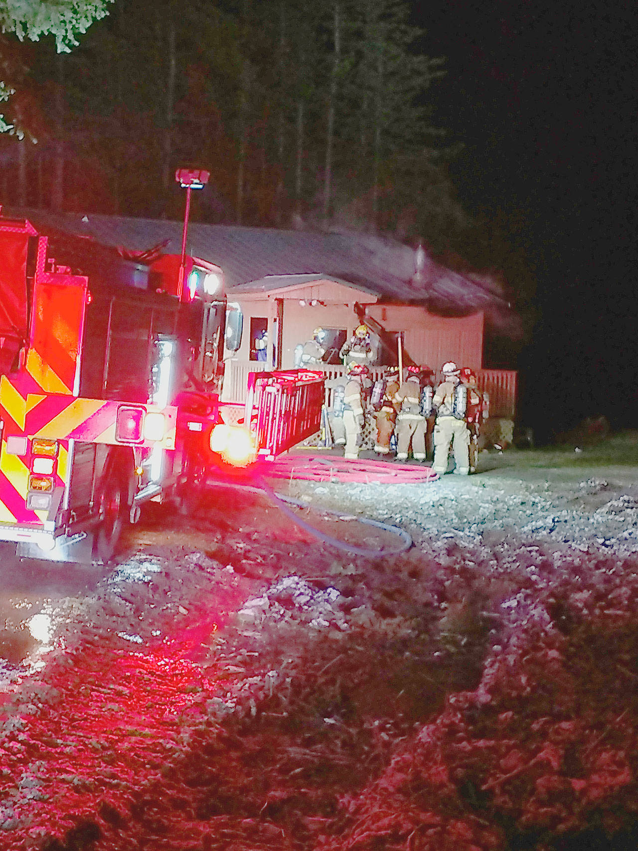 Firefighters from multiple agencies worked together on a chimney fire at a residence in Chimacum. (East Jefferson Fire-Rescue)