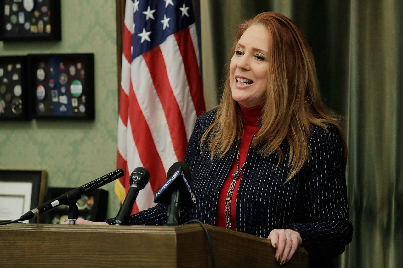 Washington Secretary of State Kim Wyman talks to reporters in her office Wednesday at the Capitol in Olympia. Wyman was talking about a series of election- and ballot-security bills her office is asking the Washington Legislature to consider during the current session. (Ted S. Warren/The Associated Press)