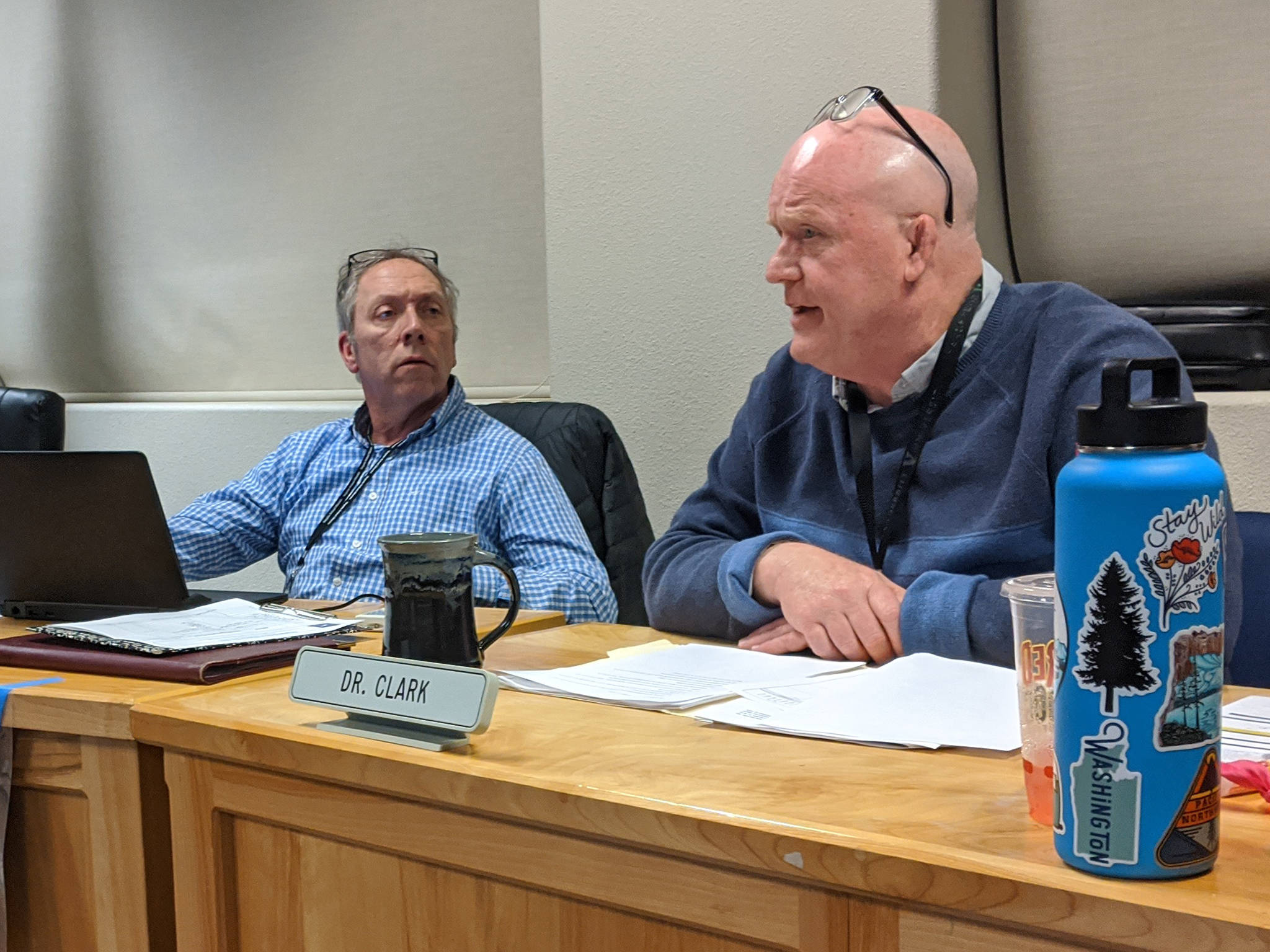 Sequim School Superintendent Rob Clark, right, discusses terms of his contract extension with the school board while board president Brandino Gibson listens on. Conor Dowley/Olympic Peninsula News Group