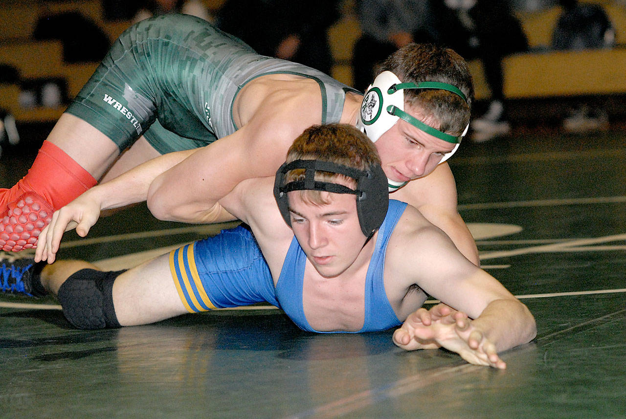 Port Angeles’ Josh Boe, top, grapples with Bremerton’s Colby Furness in the 145-lb. class Wednesday, Jan. 29, 2020, at Port Angeles High School. Boe went on to win by pinning his opponent. (Keith Thorpe/Peninsula Daily News)