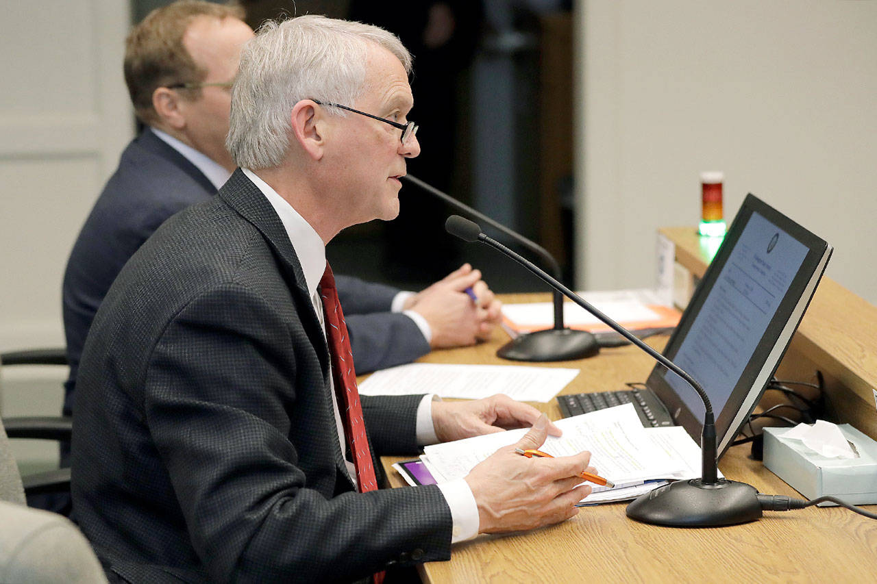 Paul Roberts, a member of the Everett City Council and vice chairman of the Sound Transit Board of Directors, speaks Tuesday during a hearing before the state Senate Transportation Committee at the Capitol in Olympia. (Ted S. Warren/The Associated Press)