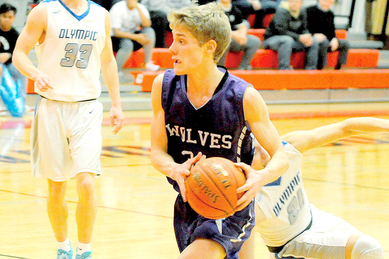 BOYS BASKETBALL: Sequim outmuscled by Trojans in playoff tiebreaker