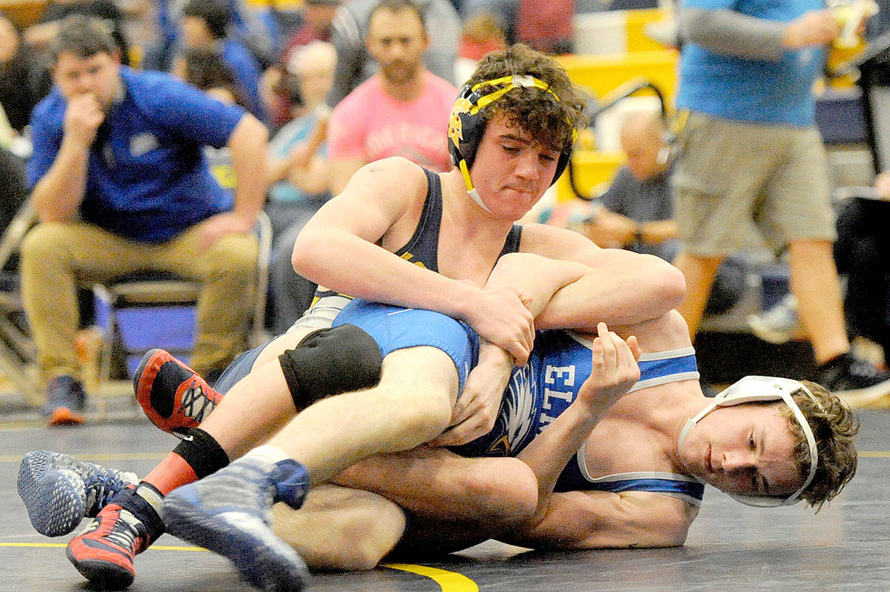 Forks’ Hayden Queen, top, pins Jacob Wilson of Elma. Queen went on to win his 170-pound weight division at the Evergreen 1A subregionals Saturday in Forks. (Lonnie Archibald/for Peninsula Daily News)