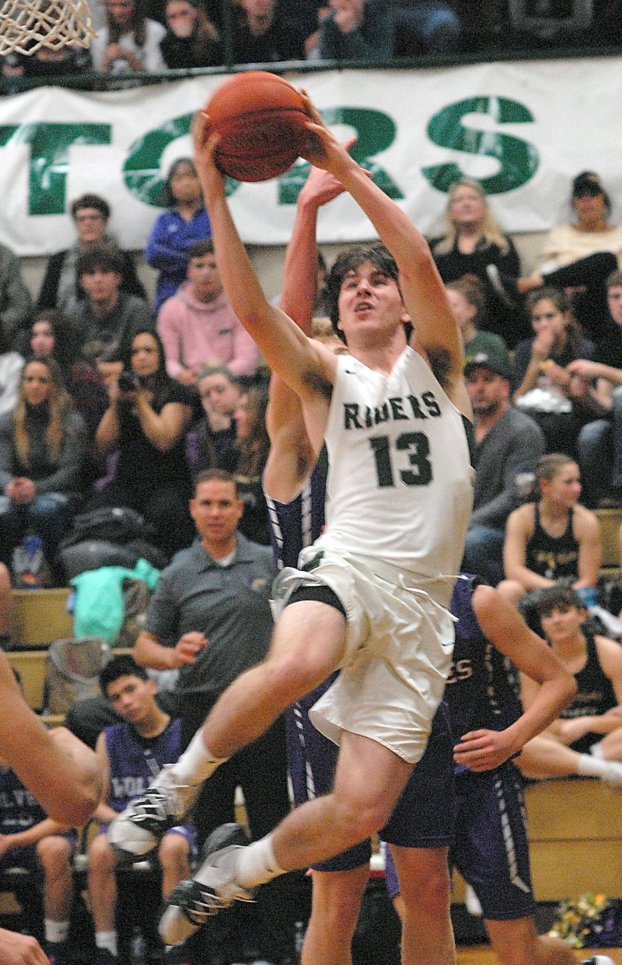 Port Angeles’ Stuart Methner attempts a shot during the Roughriders’ 57-32 win over Sequim last week. (Keith Thorpe/Peninsula Daily News)