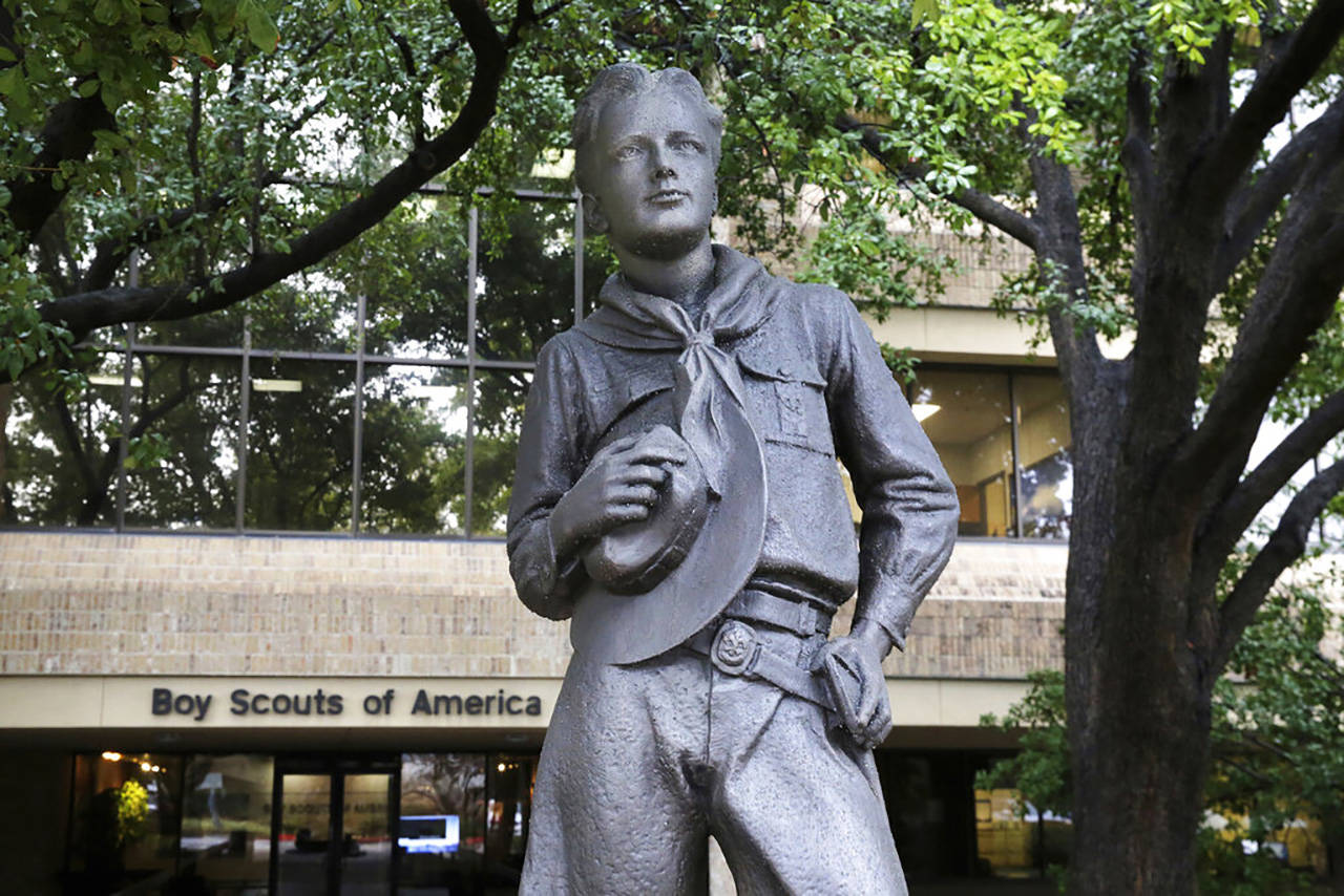In this Wednesday, Feb. 12, 2020, photo, a statue stands outside the Boys Scouts of America headquarters in Irving, Texas. The Boy Scouts of America has filed for bankruptcy protection as it faces a barrage of new sex-abuse lawsuits. (LM Otero/The Associated Press)