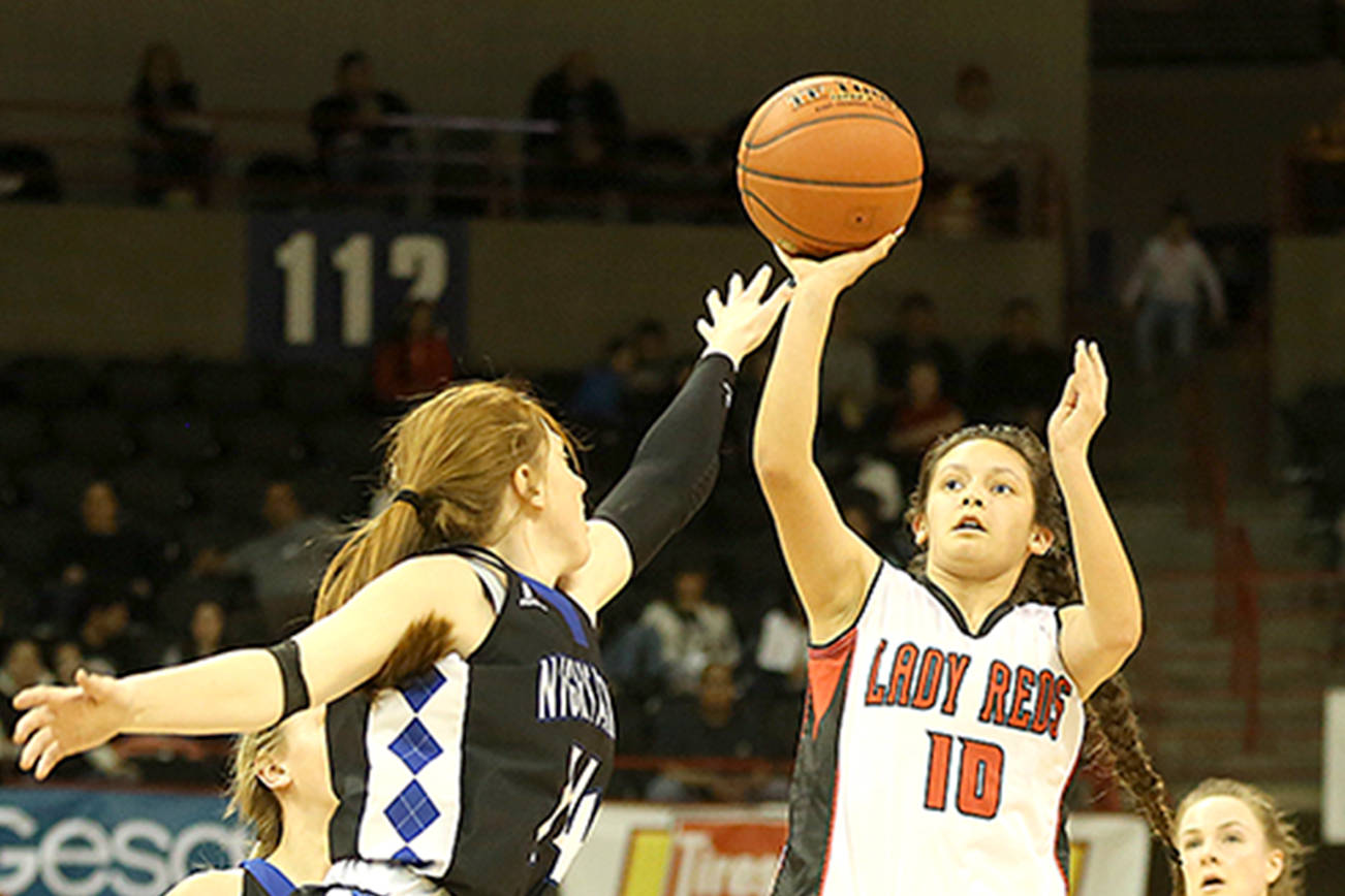 Chris Johnson/for Peninsula Daily News Neah Bay’s Allie Greene puts up a shot during the Red Devils’ 58-49 Class 1B state quarterfinal loss to No. 3 Oakesdale on Thursday at Spokane Arena.