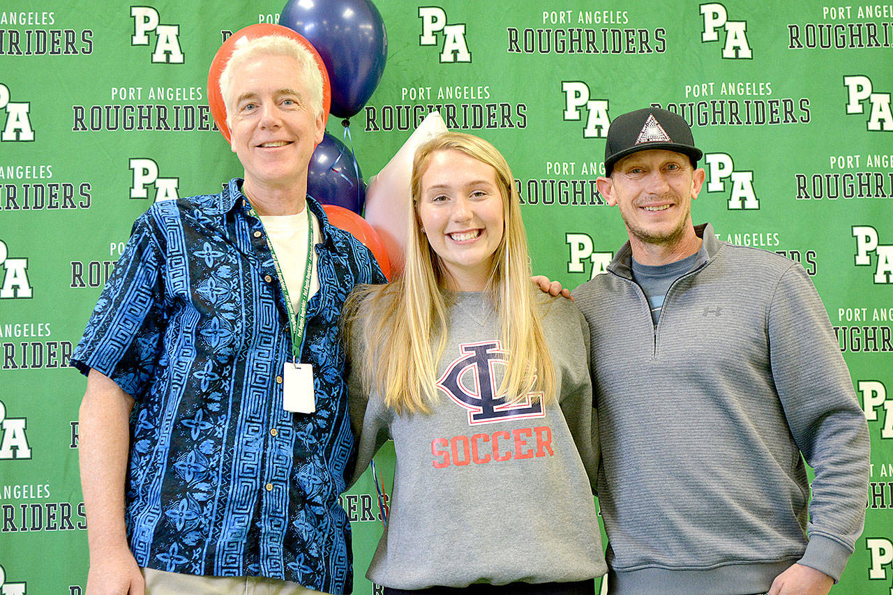 From left, Port Angeles girls coach Scott Moseley, center back Bella Money and assistant coach Aaron St. George.
