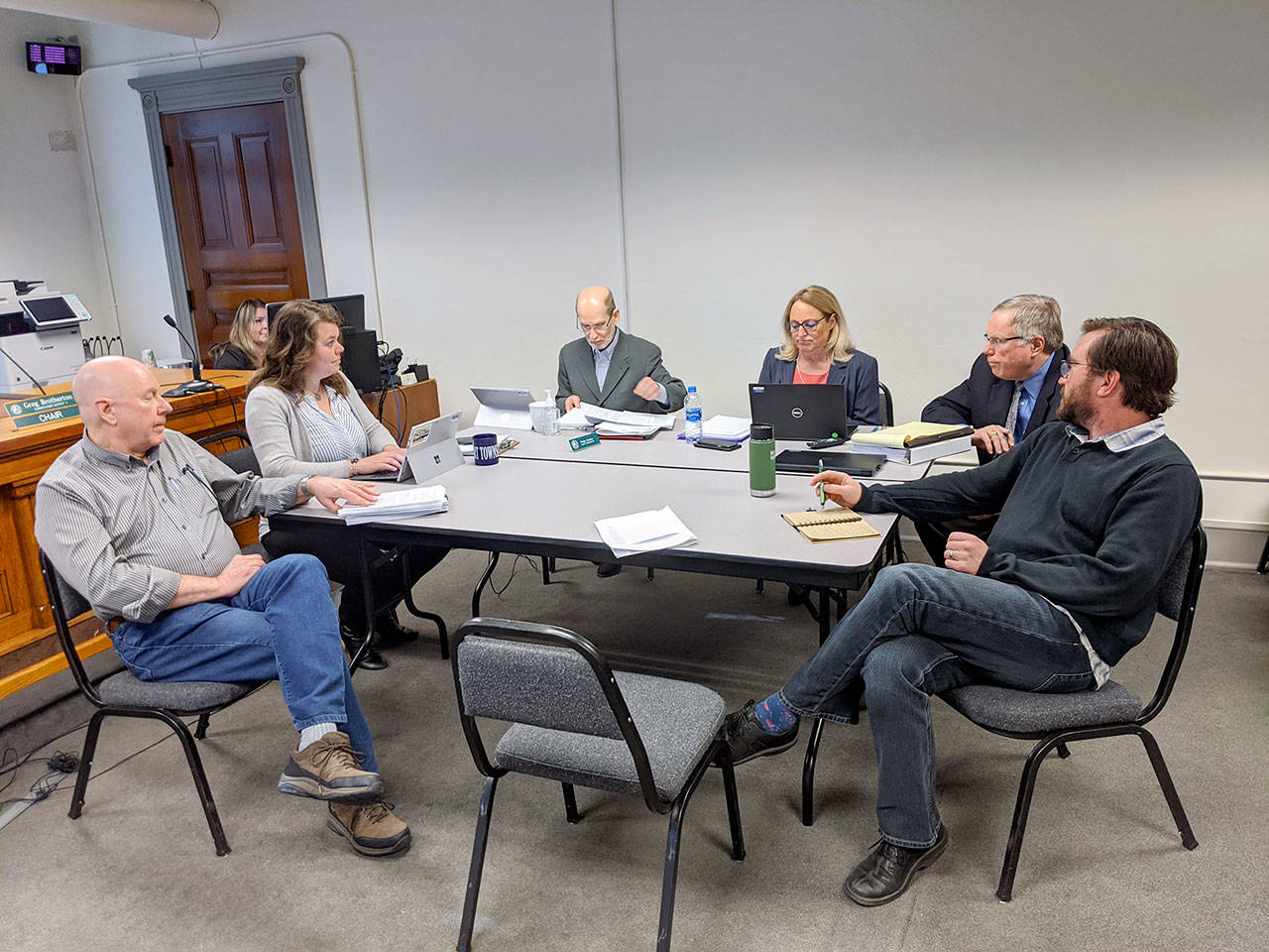 Discussing public comment they have received and potential updates to the county Critical Areas Ordinance are, from left, county commissioners David Sullivan and Kate Dean, administrator Philip Morley, Director of Community Development Patty Charnas, Deputy Civil Prosecuting Attorney Philip Hunsucker and commissioner Greg Brotherton, chair. (Zach Jablonski/Peninsula Daily News)