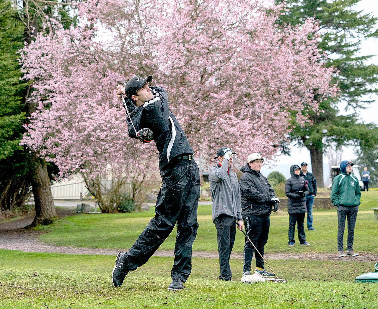 Steve Mullensky/for Peninsula Daily News                                Port Townsend’s Jacob Madison watches the flight of his ball after a drive on the first tee during a match against the Port Angeles Roughriders at Port Townsend Golf Course on Friday.