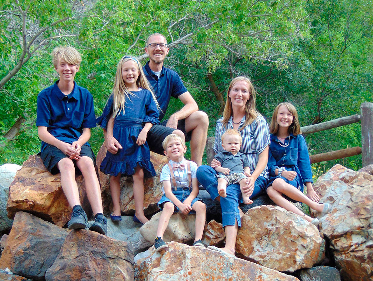 Jacob Harlan, top center, with his family. Harlan has been held in custody in China since September. (Amy Knutsen)