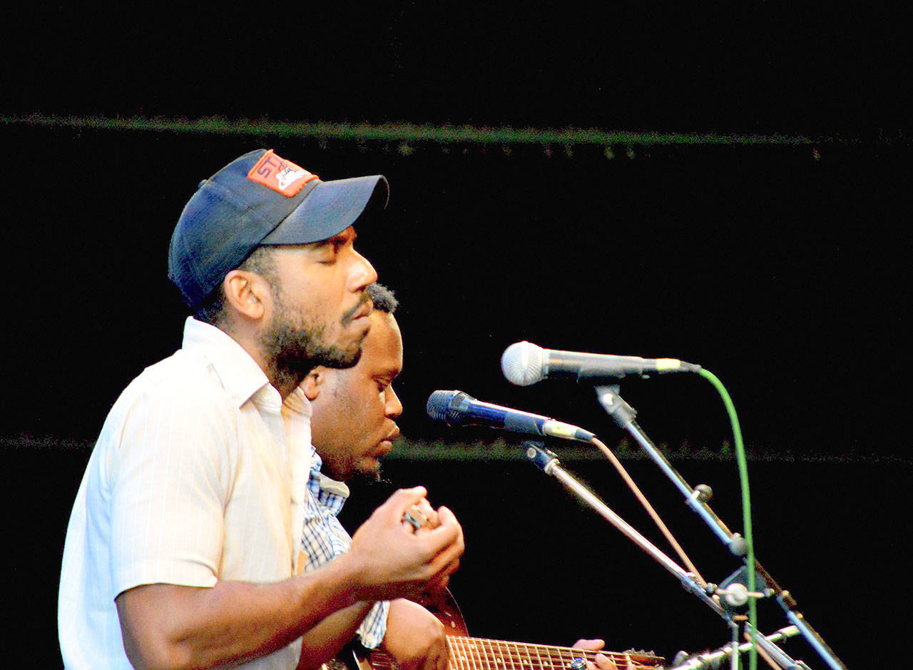 Teaching artist Andrew Alli, foreground, and artistic director Jontavious Willis are among the Acoustic Blues festival faculty who’ve had their contracts deferred to 2021. (Diane Urbani de la Paz/for Peninsula Daily News)