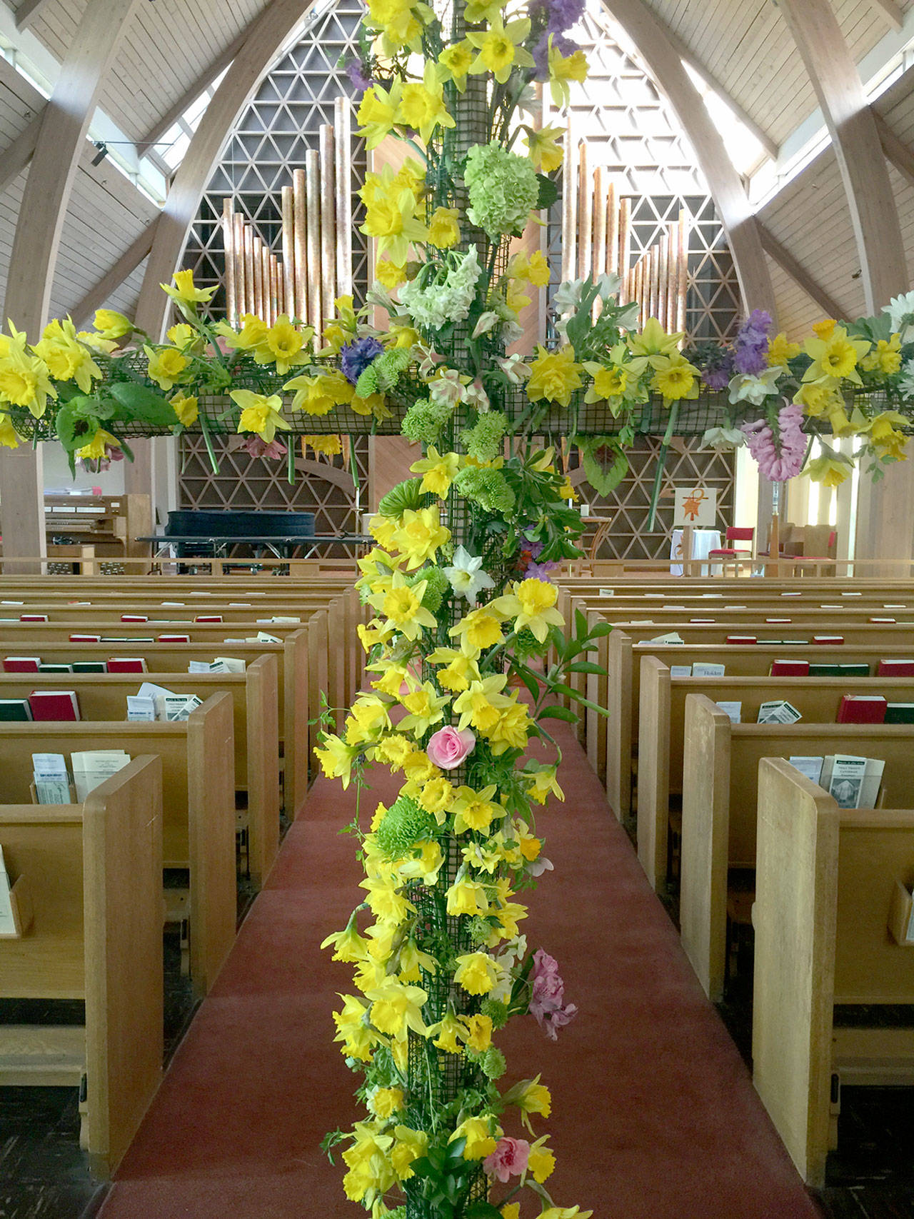 One of the downsides for many in the faith community is not being able to view the Easter decorations this Sunday, such as this cross at Holy Trinity Lutheran Church in Port Angeles. (Holy Trinity Lutheran Church Port Angeles)