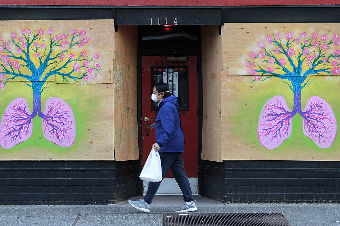 ‘New normal’: distancing, masks likely needed for months