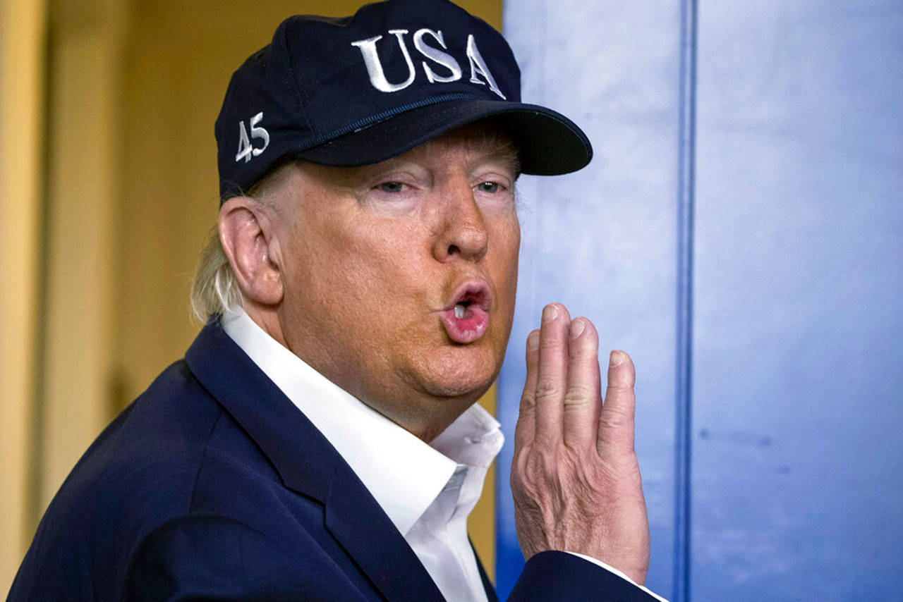 In this March 14, 2020, file photo, President Donald Trump talks after speaking during a news conference about the coronavirus in the James Brady Briefing Room at the White House in Washington. Trump’s name will be printed on the stimulus checks that the Internal Revenue Service will be sending to tens of millions of Americans around the country. It’s an unprecedented move finalized this week. That’s according to two officials with knowledge of the decision, who spoke to The Associated Press on Wednesday on the condition of anonymity to discuss internal planning. (Alex Brandon/The Associated Press file)