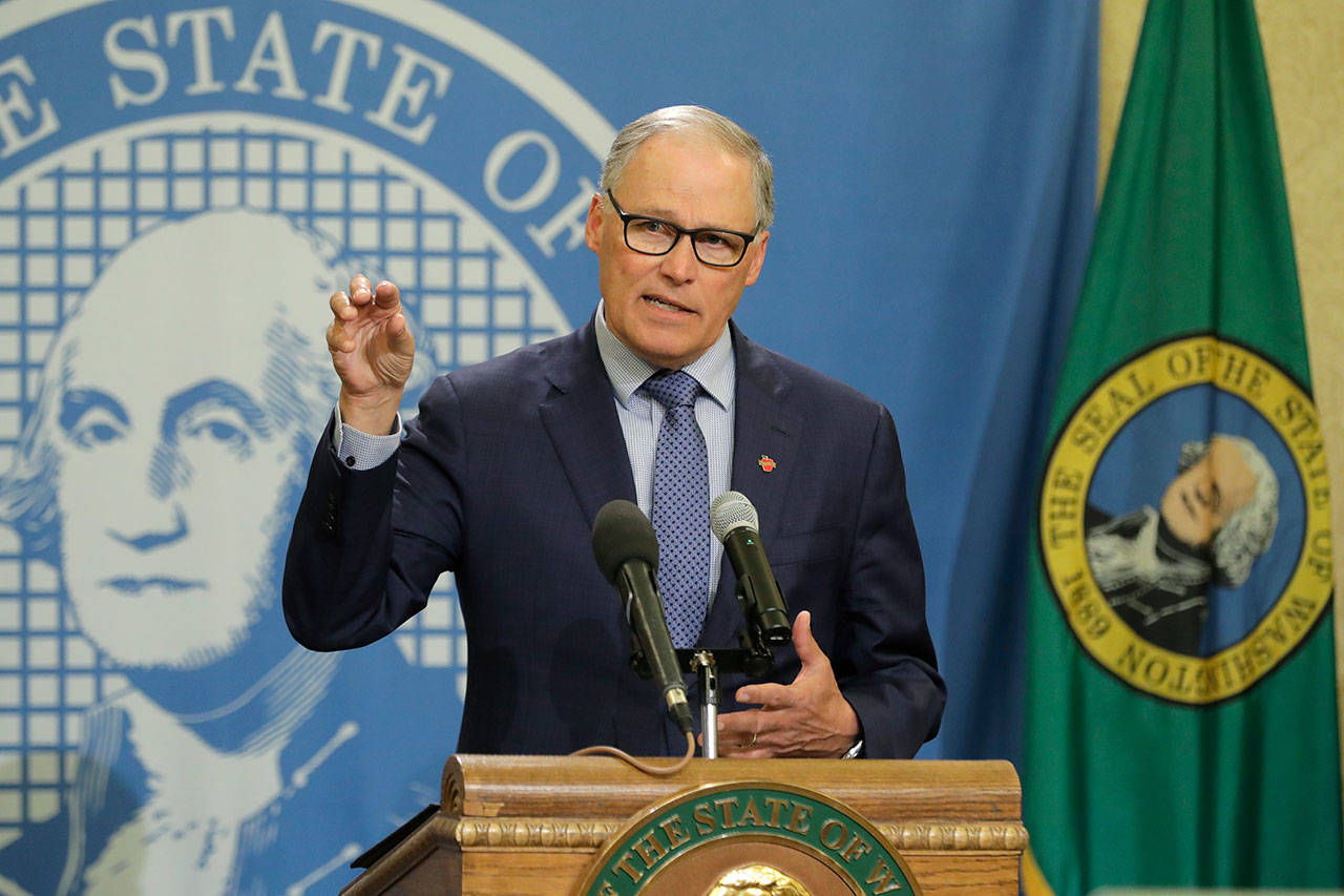 Washington Gov. Jay Inslee speaks during a news conference Monday, April 13, 2020, at the Capitol in Olympia. Inslee, along with California Gov. Gavin Newsom and Oregon Gov. Kate Brown, announced Monday that they will work together to re-open their economies while continuing to control the spread of COVID-19. (Ted S. Warren/The Associated Press)