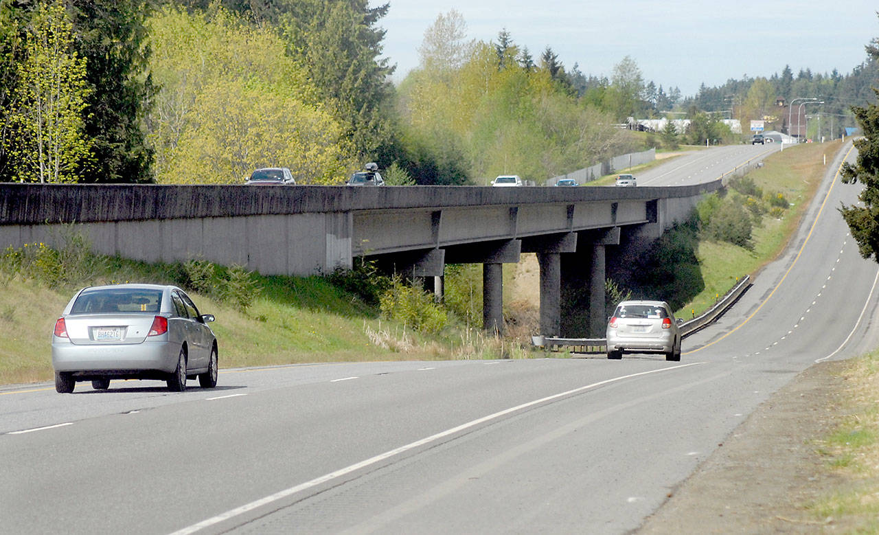 U.S. Highway 101 crosses Siebert Creek east of Port Angeles on Wednesday, April 29, 2020, with the eastbound lanes using an elevated span while westbound traffic passes over a concrete culvert beneath the roadway. (Keith Thorpe/Peninsula Daily News)
