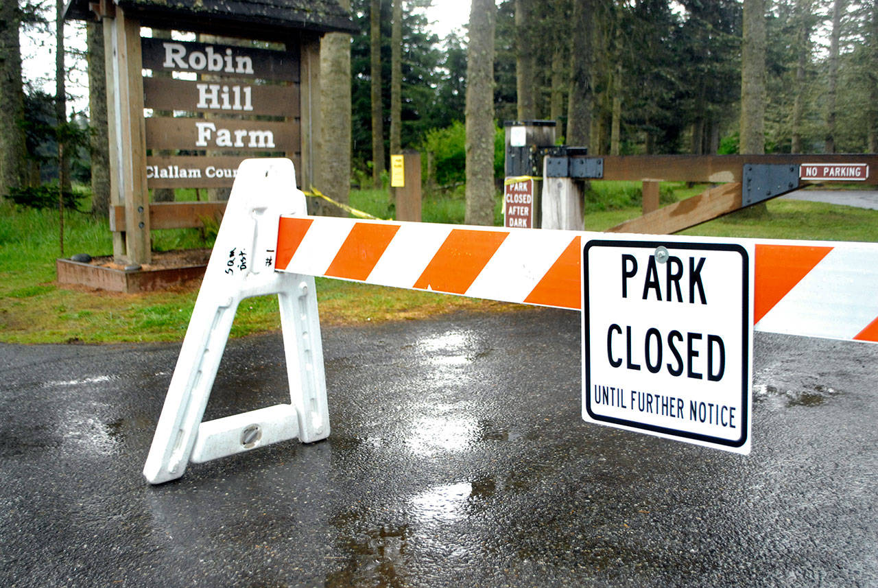 A barricade blocks the north entrance to Robin Hill Farm County Park west of Sequim on Saturday, May 2, 2020. (Keith Thorpe/Peninsula Daily News)