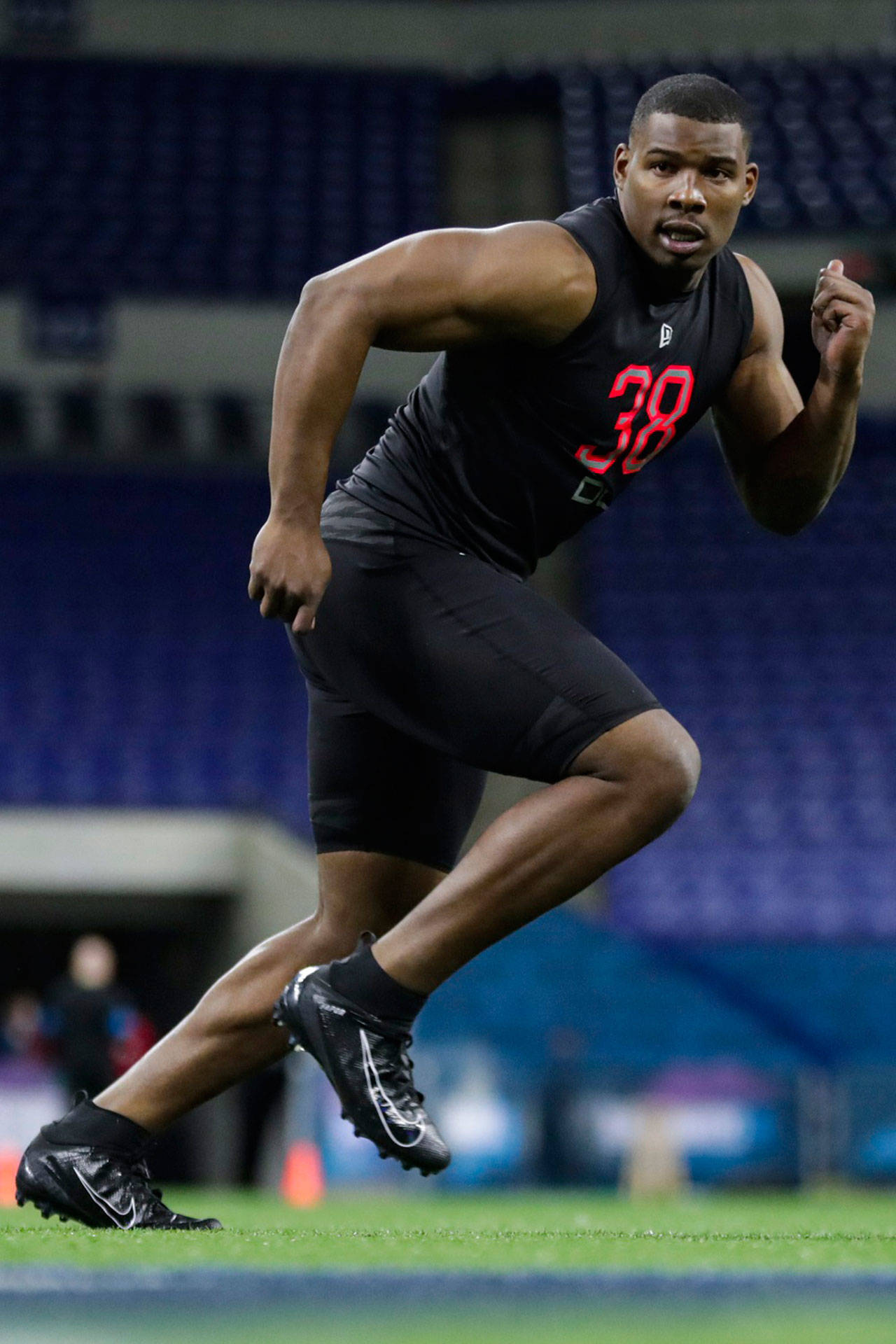 In this Feb. 29, 2020, file photo, Syracuse defensive lineman Alton Robinson runs a drill at the NFL football scouting combine in Indianapolis. In Darrell Taylor and Alton Robinson the Seattle Seahawks believe they could have their pass rushers of the future. (AP Photo/Michael Conroy, File)