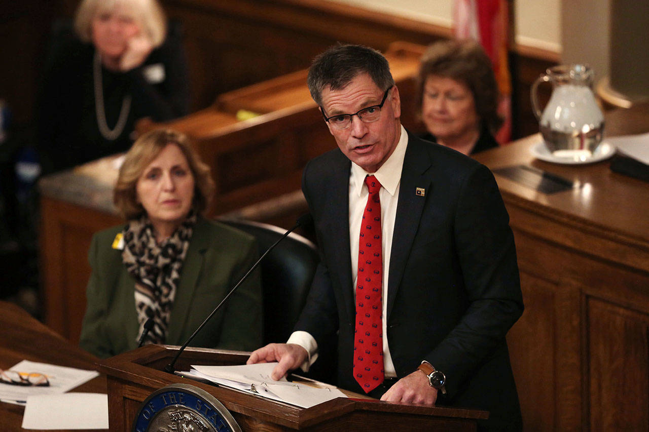 In this Feb. 10, 2020, file photo, Wyoming Gov. Mark Gordon addresses a joint session of Wyoming Legislature for the State of the State address in Cheyenne, Wyo. An Associated Press analysis shows that some of the least-populated states, including Wyoming, with relatively few coronavirus cases received an out-sized proportion of the $150 billion in federal money that was designed to address virus-related expenses. Gordon is proposing using a portion of the money for direct help for businesses that have suffered because of government-imposed shutdowns and shrunken demand. (Cayla Nimmo/The Casper Star-Tribune via AP, File)