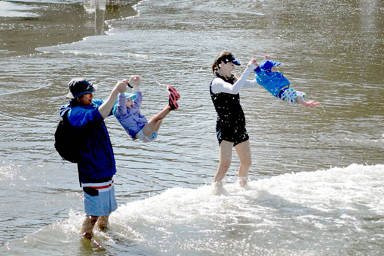 Wind and waves: Families take advantage of warm weekend weather