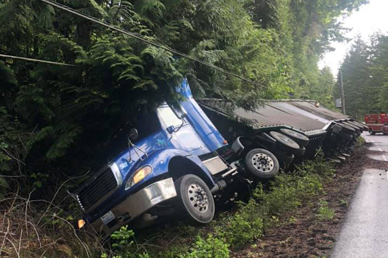 Semi-rollover blocking both lanes of 101 near Brinnon
