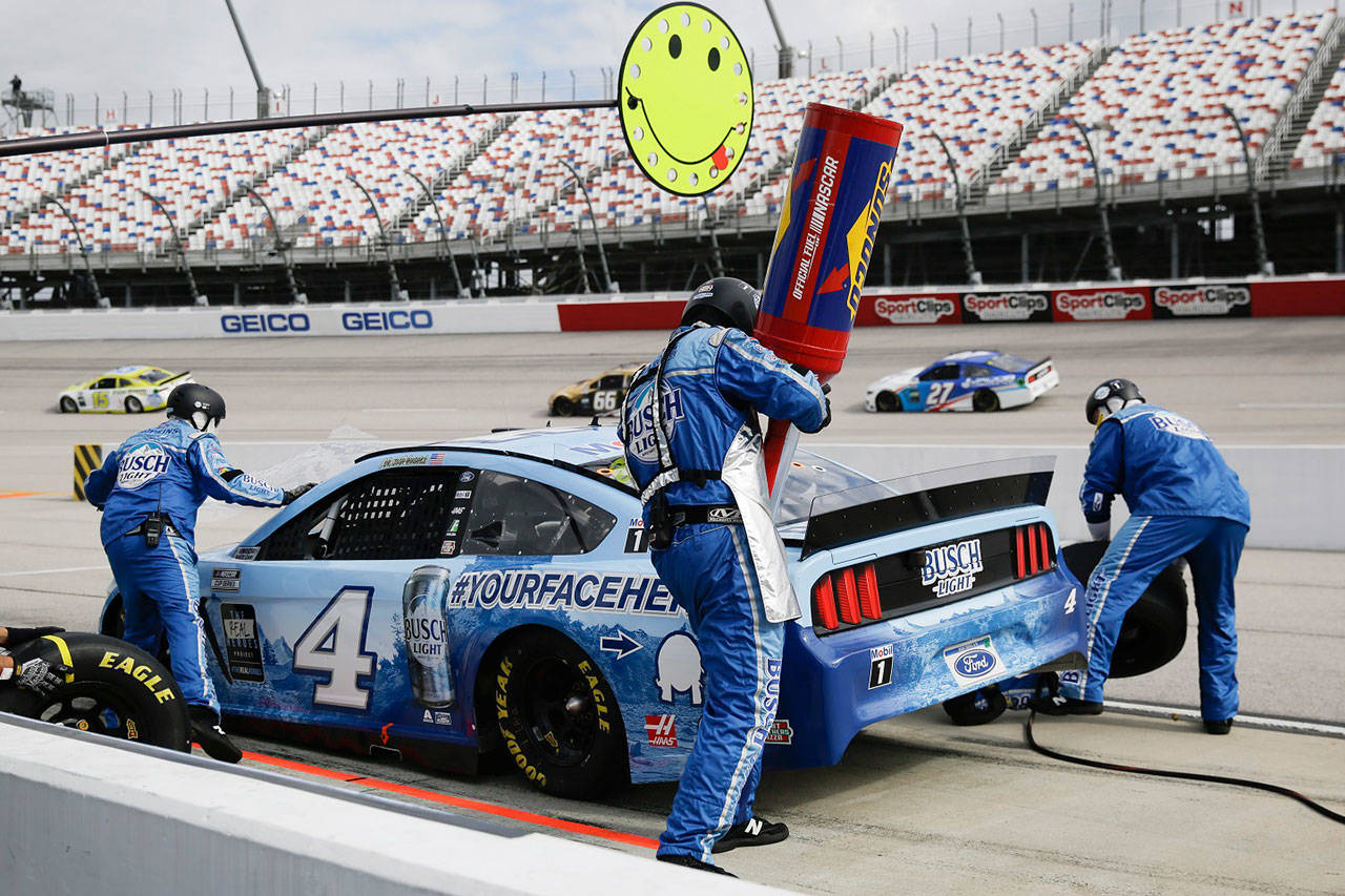 Kevin Harvick (4) makes a pit stop during the NASCAR Cup Series auto race Sunday in Darlington, S.C. (Brynn Anderson/Associated Press)
