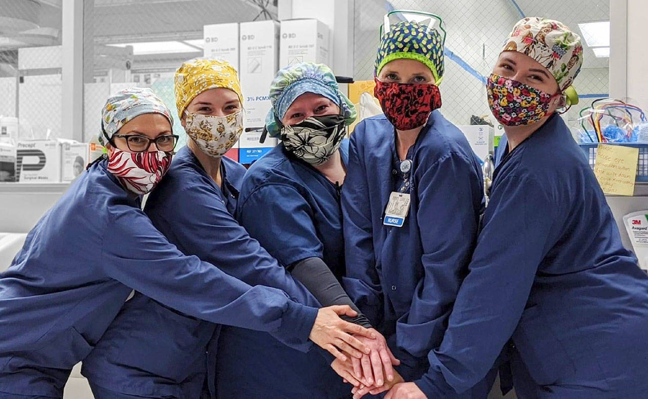 Olympic Medical Center nurses, from left, Stephanie Carroll, Nicole Picinich, Brandy Ebalo, Amy Williams and Kayle Grammer are among the 137 OMC employees who have registered for the OMCares May Virtual Run/Walk. (Submitted photo)