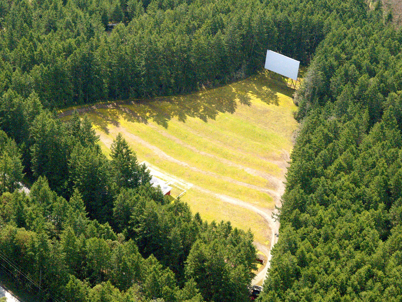 Port Townsend’s Wheel-In Motor Movie drive-in awaits Friday night, when it will allow up to 70 cars in for a double feature at dusk. The venue is expected to run classic movies for the next several weekends. (Wheel-In Motor Movie)