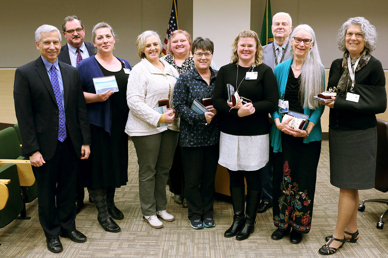 Pictured, from left to right, are Eric Lewis, CEO, Dr. Scott Kennedy, Sam Reynolds, Holly Wickersham, quality support services director Liz Uraga, Brenda Tassie, Michelle Samples, OMC board president Jim Leskinovitch, Sandy Ulf and Paula Wahl. Carol Kittrick is not pictured.