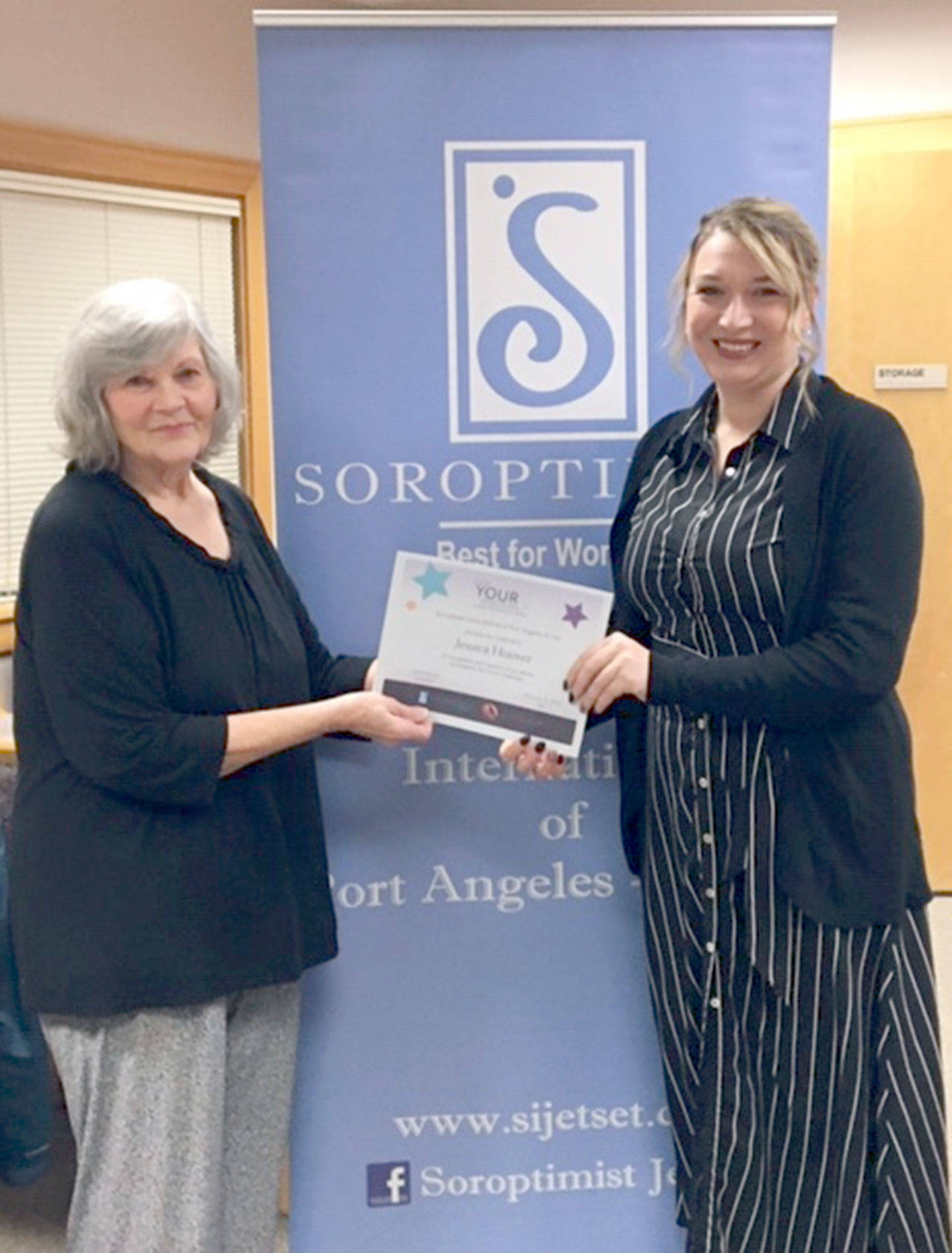 Jessica Hoover, on the right, receives a $2,000 Live Your Dream award from Linda Suela of the Soroptimist International Jet Set. Hoover also won a $5,000 regional Soroptimist Live Your Dream award and is now eligible to compete for one of three $10,000 international awards. Live Your Dream awards may be used by recipients to offset any costs associated with their pursuit of higher education.