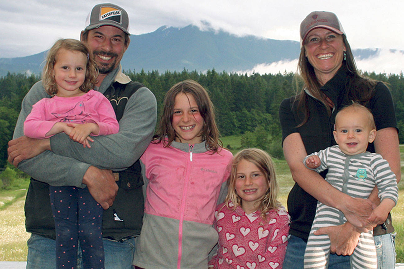 HORSEPLAY: A family with their hands, hearts full