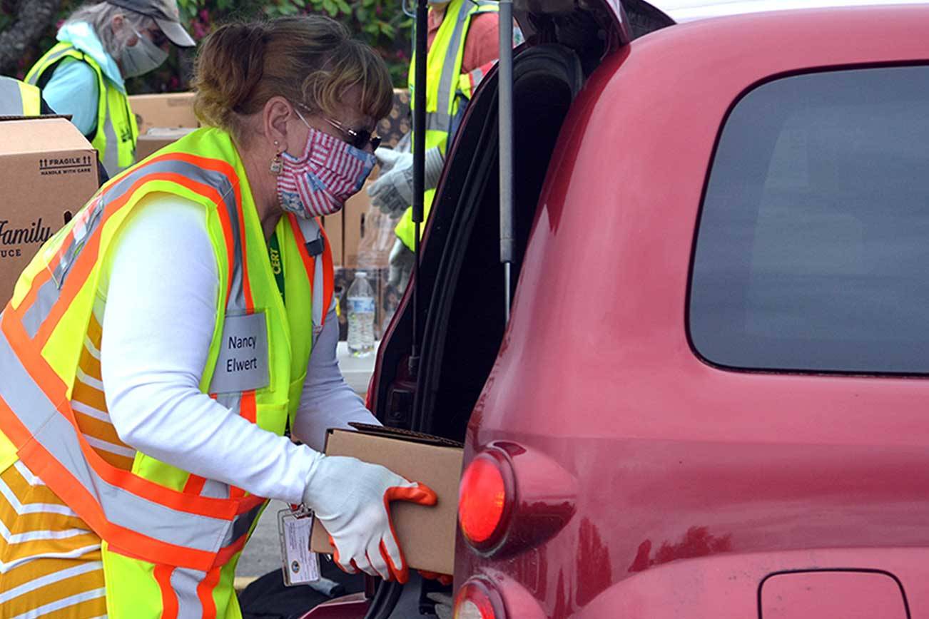 Volunteers distribute food boxes in Sequim, Port Angeles
