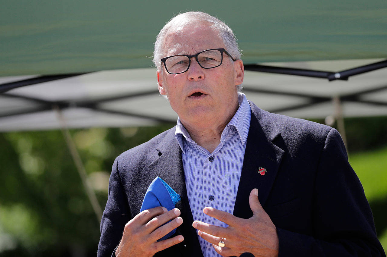 Washington state Gov. Jay Inslee talks about the high rate of coronavirus cases in the area during a news conference at Yakima Valley College Tuesday, June 16, 2020, in Yakima, Wash. Inslee met with leaders in local government, health care and business to discuss the impact of the COVID-19 pandemic in the area, which has one of the highest rates of infection in the state. (AP Photo/Elaine Thompson)