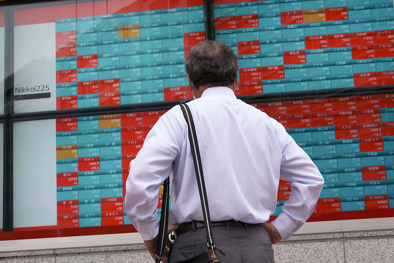 Stocks slide on Wall Street as coronavirus cases surge