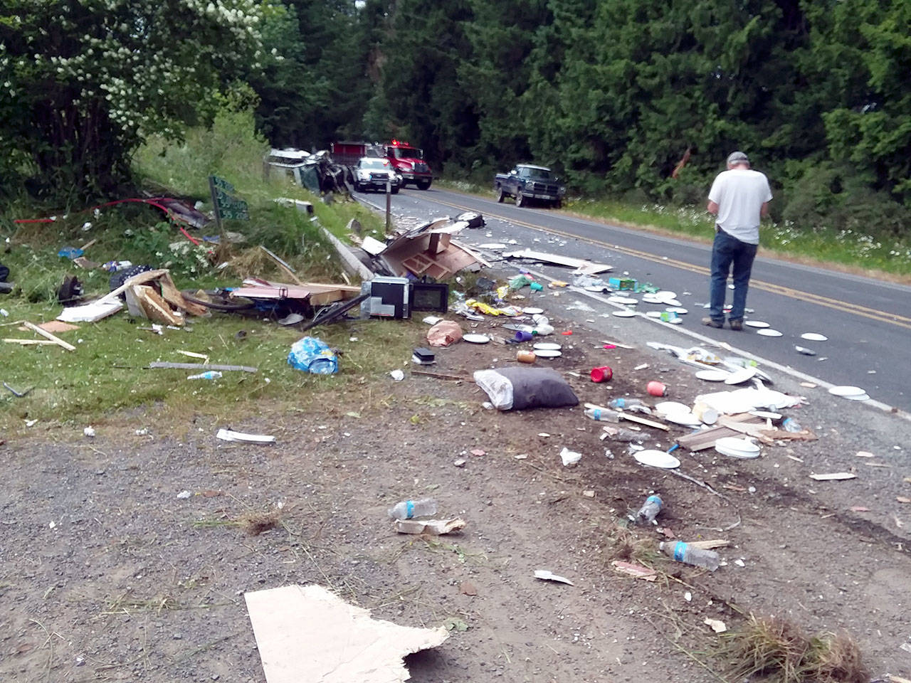 Debris was scattered along state Highway 112 near Dodger Lane after a two-car collision.