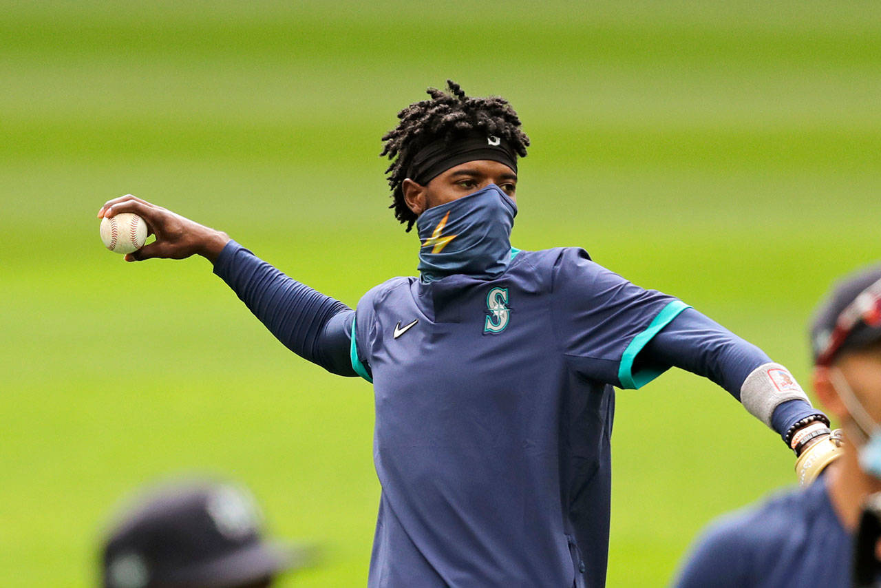 Seattle Mariners Dee Gordon tosses a ball at a baseball practice Tuesday, July 7, 2020, in Seattle. Even in a 60-game sprint season, this will not be the year that team comes to fruition. If anything, the truncated season may delay some of the Mariner’s rebuilding plans, but still with the optimistic hope the club begins turning the corner into contention in 2021. (Elaine Thompson/Associated Press)