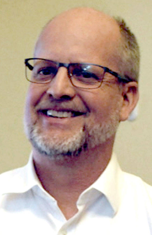 Chimacum School District Superintendent Rick Thompson, seen here as he was congratulated by Jefferson County Commissioner Kathleen Kler when he learned the $7.95 million capital levy was passed by district voters, has been placed on paid administrative leave after he filed a complaint against the school board. (Peninsula Daily News)