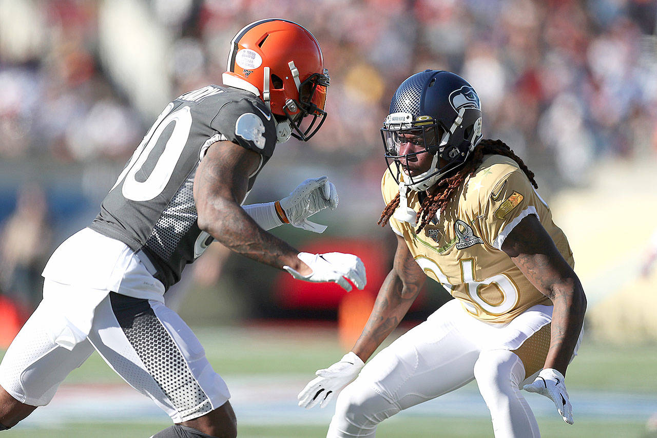 NFC cornerback Shaquill Griffin, of the Seattle Seahawks, covers AFC wide receiver Jarvis Landry, of the Cleveland Browns, during the NFL Pro Bowl football game, Sunday, Jan. 26, 2020, in Orlando, Fla. (Steve Luciano/Associated Press)