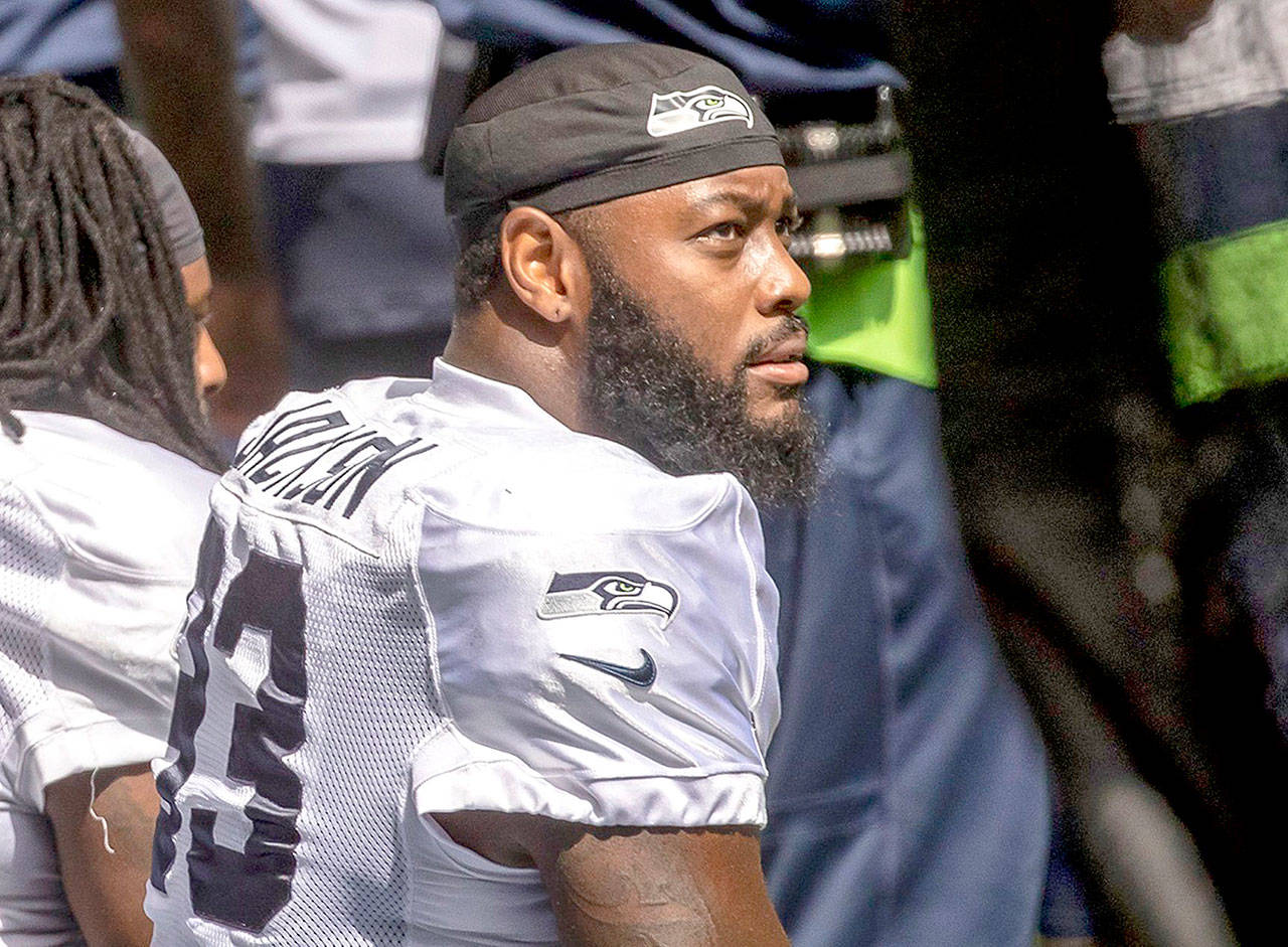 Seattle Seahawks defensive end Branden Jackson looks on before a mock NFL football game in Seattle Saturday, Aug. 22, 2020. (Bettina Hansen/The Seattle Times via AP)