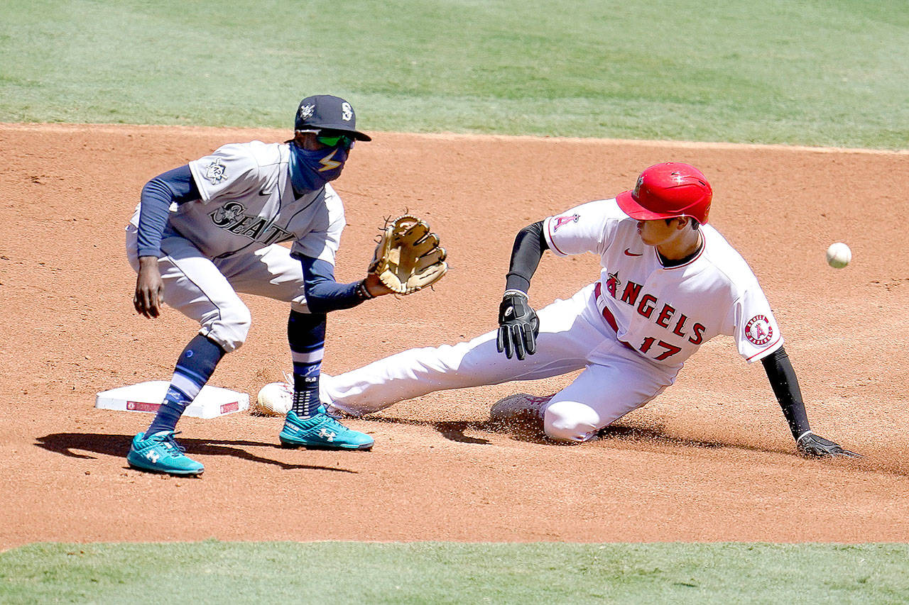 Los Angeles Angels’ Shohei Ohtani, right, steals second base next to Seattle Mariners second baseman Dee Gordon during the first inning Sunday in Anaheim, Calif. (AP Photo/Marcio Jose Sanchez)
