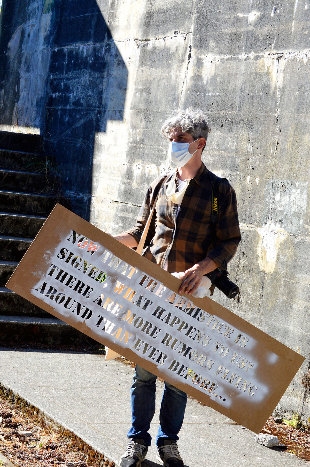 Aaron Asis orchestrated “Fort Words,” his art installation at Fort Worden, using local oral histories, stencils and paint. (Photo by Diane Urbani de la Paz/for Peninsula Daily News)