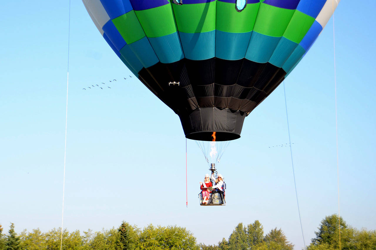 Cherie Kidd, Ms. Senior USA 2019-2020, left, and Captain-Crystal Stout, Ms. Senior Washington USA, film a promotional video from Stout’s Dream Catcher balloon for the Ms. Senior USA pageant in October. (Matthew Nash/Olympic Peninsula News Group)
