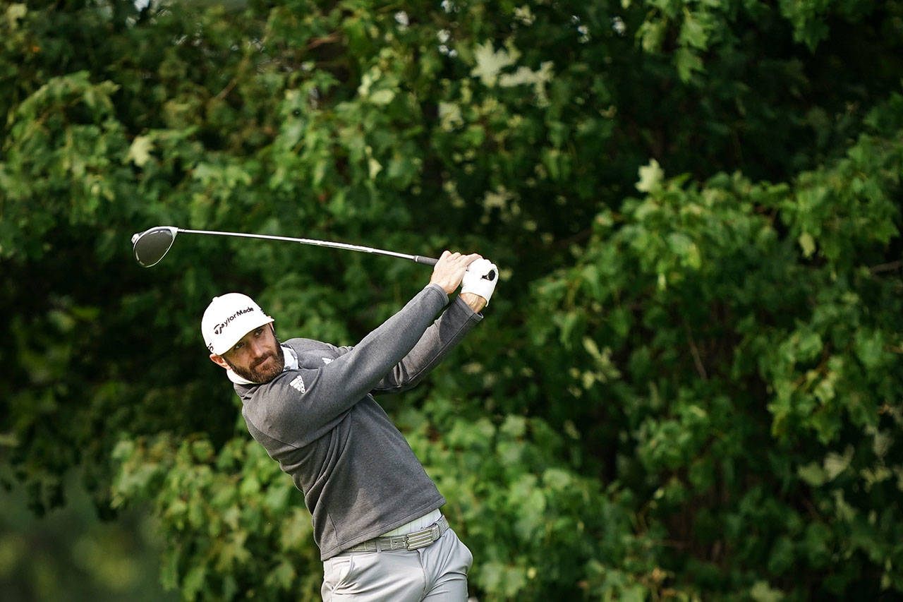 Dustin Johnson tees off on the 12th hole during practice before the U.S. Open Championship golf tournament at Winged Foot Golf Club on Tuesday, Sept. 15, 2020, in Mamaroneck, N.Y. (John Minchillo/Associated Press)