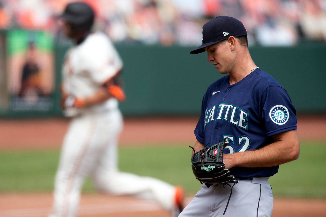 Seattle Mariners starting pitcher Nick Margevicius (52) reacts to yielding a solo home run to San Francisco Giants’ Darin Ruf during the second inning of a baseball game Thursday, Sept. 17, 2020, in San Francisco. (D. Ross Cameron/Associated Press)