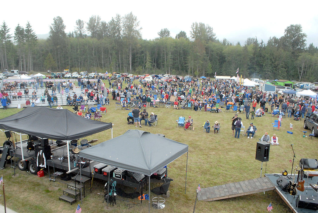 A crowd numbering in the hundreds gathers to hear a slate of speeches by state and local Republican candidates and live music on Saturday at Extreme Sports Park west of Port Angeles. (Keith Thorpe/Peninsula Daily News)