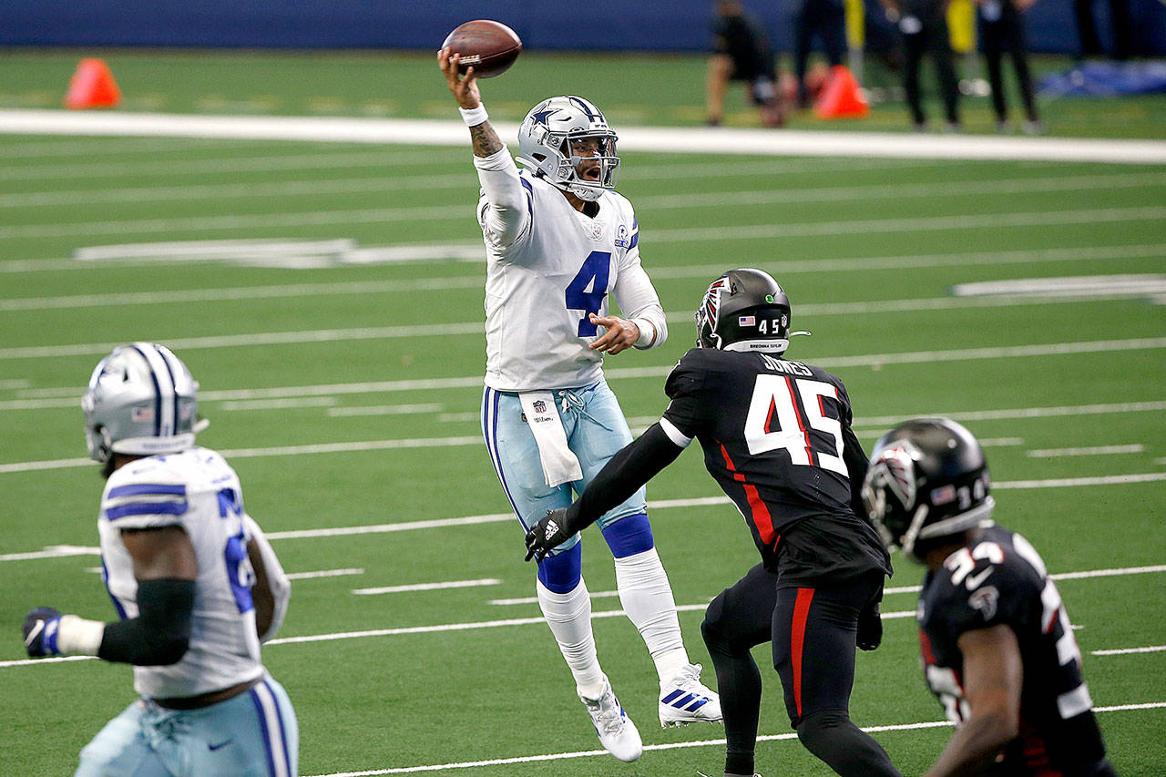 Dallas Cowboys quarterback Dak Prescott (4) throws a pass under pressure fro Atlanta Falcons linebacker Deion Jones (45) in the second half of an NFL football game in Arlington, Texas, Sunday, Sept. 20, 2020. (AP Photo/Ron Jenkins)