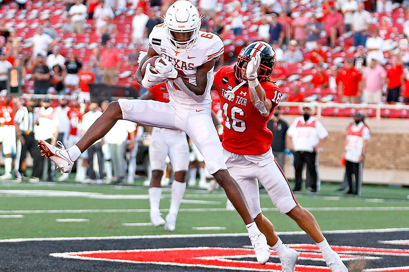 COLLEGE FOOTBALL ROUNDUP: No. 8 Texas rallies, beats Texas Tech 63-56 in OT