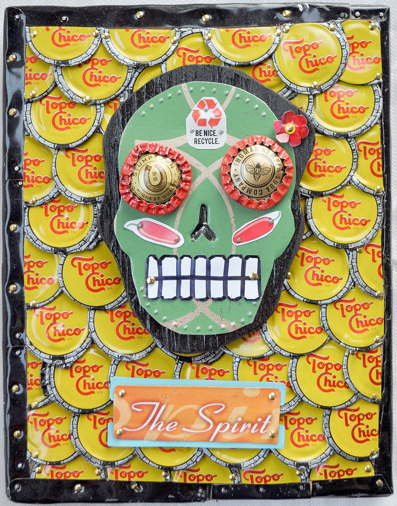 Loren Scruggs’ bright, bottle cap art is featured at the Port Townsend Gallery this month.